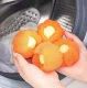 Veļas bumba mājdzīvnieku spalvu un pūku noņemšanai AG895A, oranža