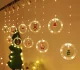 LED logu gaismas aizkars ar zvaigznēm un figūriņām 3 m 125 LED, silti balts