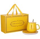 Electric mug warmer with cup, lid and spoon, yellow