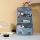Travel toiletry bag with roll-up design, blue