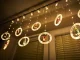 LED logu gaismas aizkars ar zvaigznēm un figūriņām 3 m 125 LED, silti balts